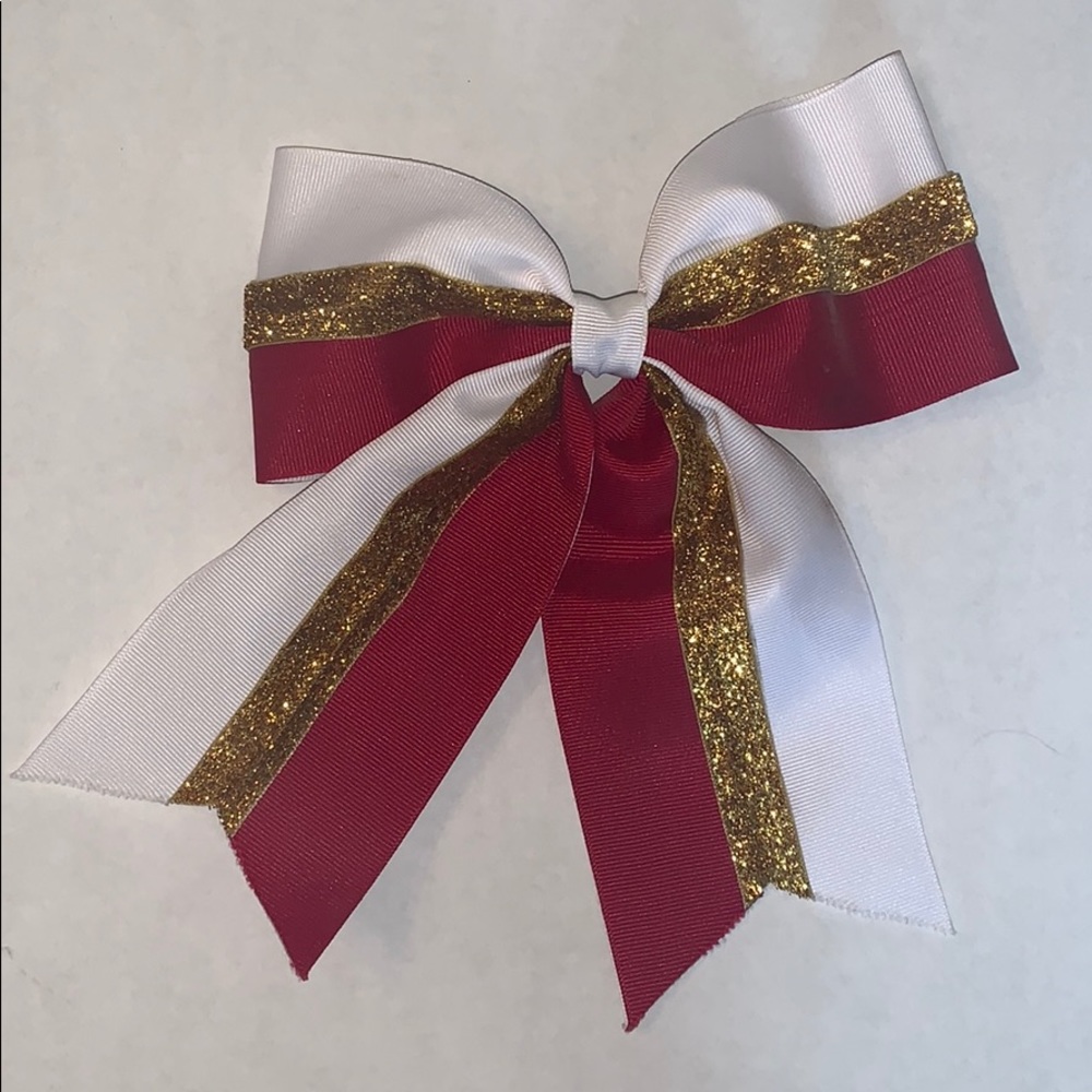 Cardinal, gold, and white cheerleading bow